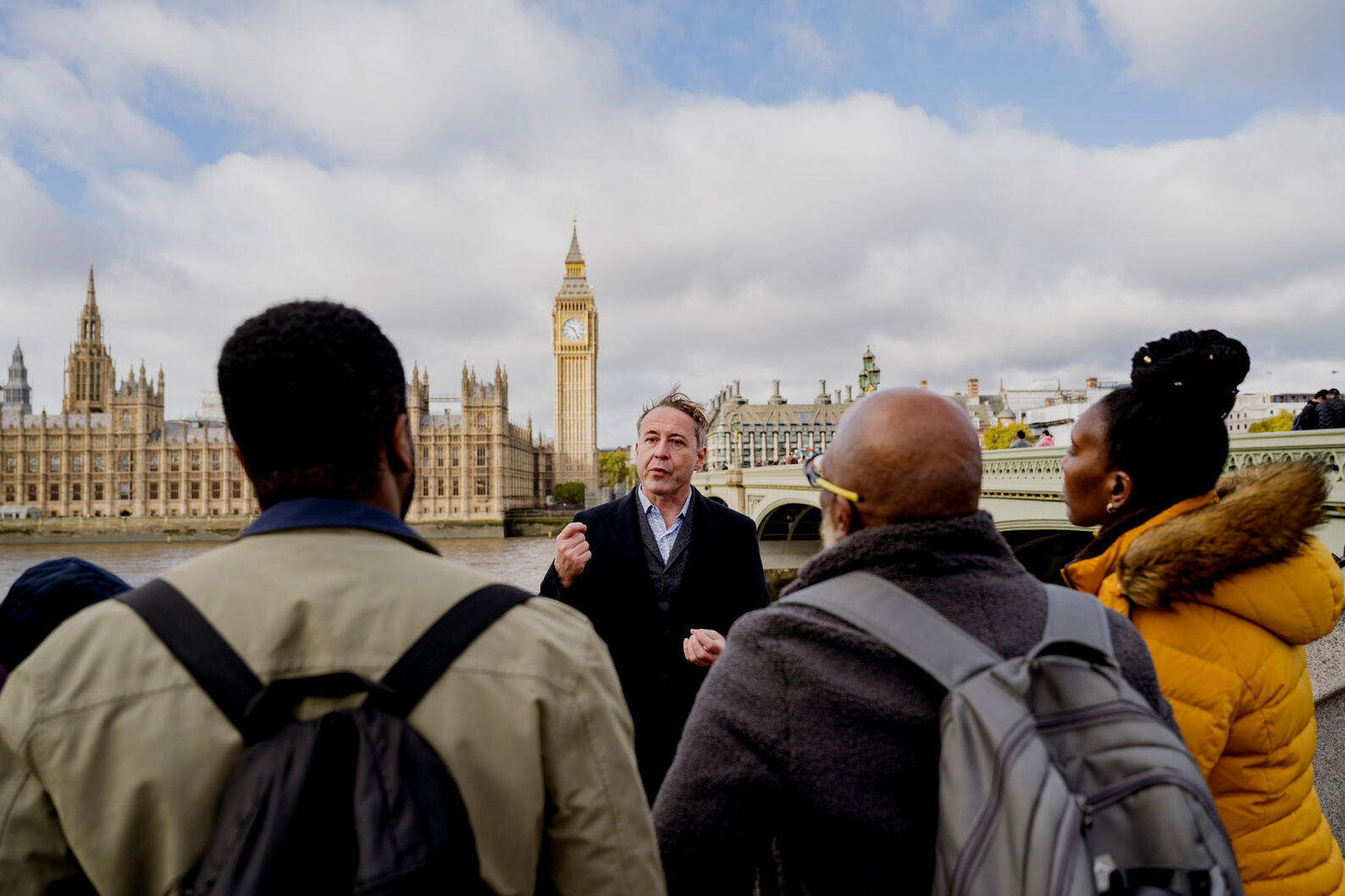 Vacationers enjoying guided tour of London